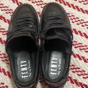 Fenty by Rihanna, shiny black pumas